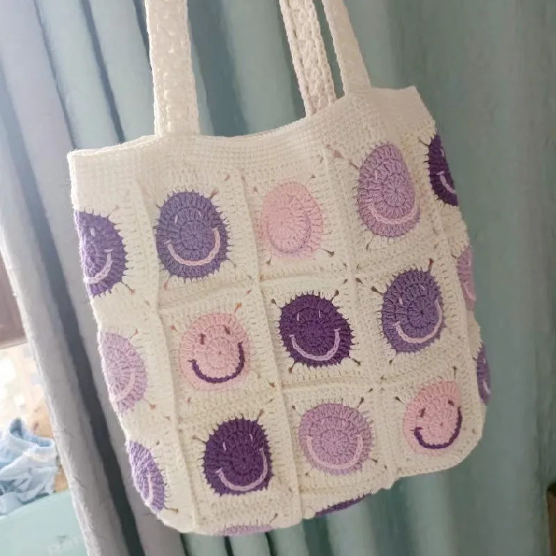 Handmade woven smiling face shoulder bag, hand-held flower bag, simple and fashionable women\'s shopping bag, large capacity