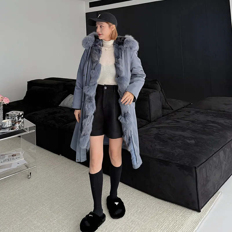 Le nouveau manteau d'hiver en fourrure semblable à du renard, veste mi-longue avec Parka détachable de Pai Pai est à la mode et au chaud pour les femmes