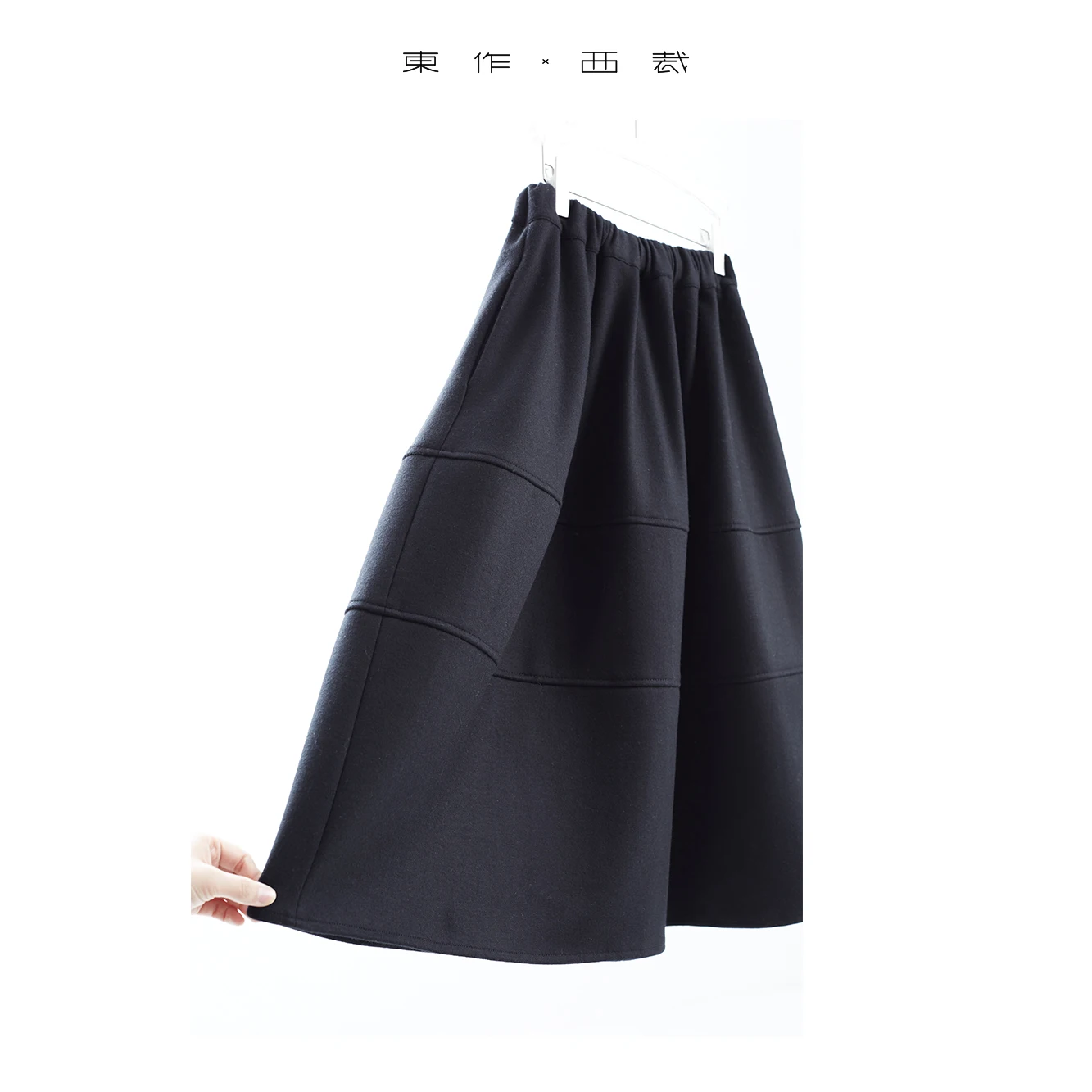 Lussuosa e squisita in stile coreano nuova gonna ombrello di fascia alta in lana nera autunno e inverno 2025 per donna