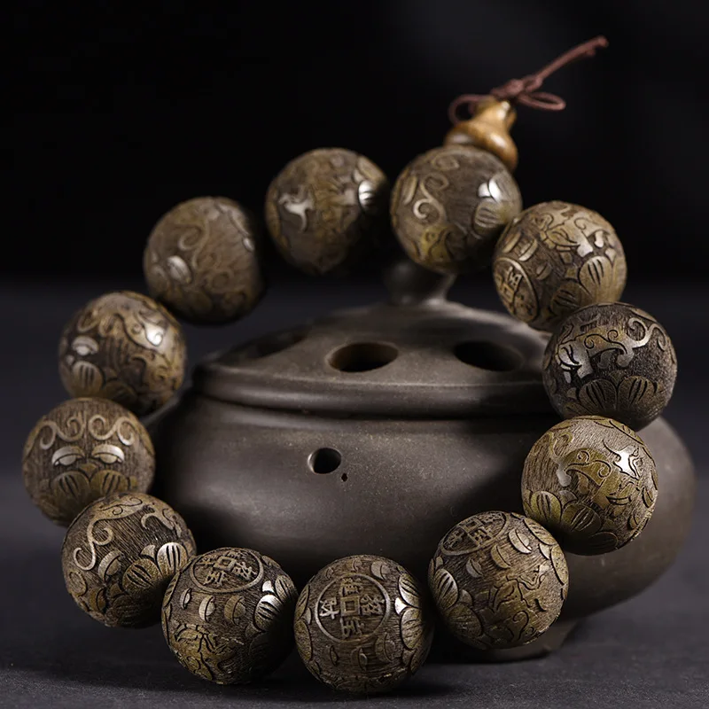 Sichuan golden nanmu dark wood laser-engraved Buddha beads with the image of Amitabha and auspicious clouds, a decorative hand b