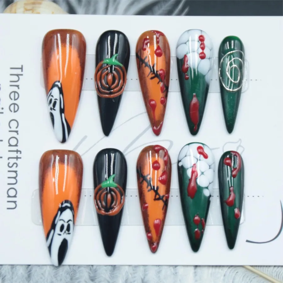 Handmade pressed fake nails, pumpkin Halloween elements, adhesive fake nails, long pointed styles, finished nail art,