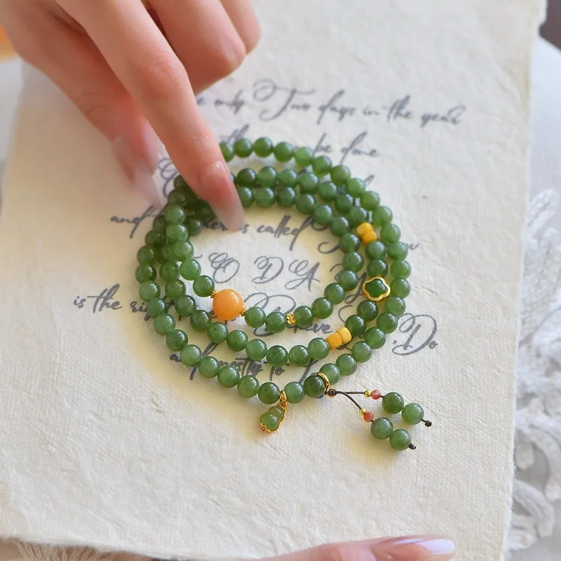 Natural Hetian jadeite bracelet three strands paired with aged amber 6mm in size featuring fine and delicate material