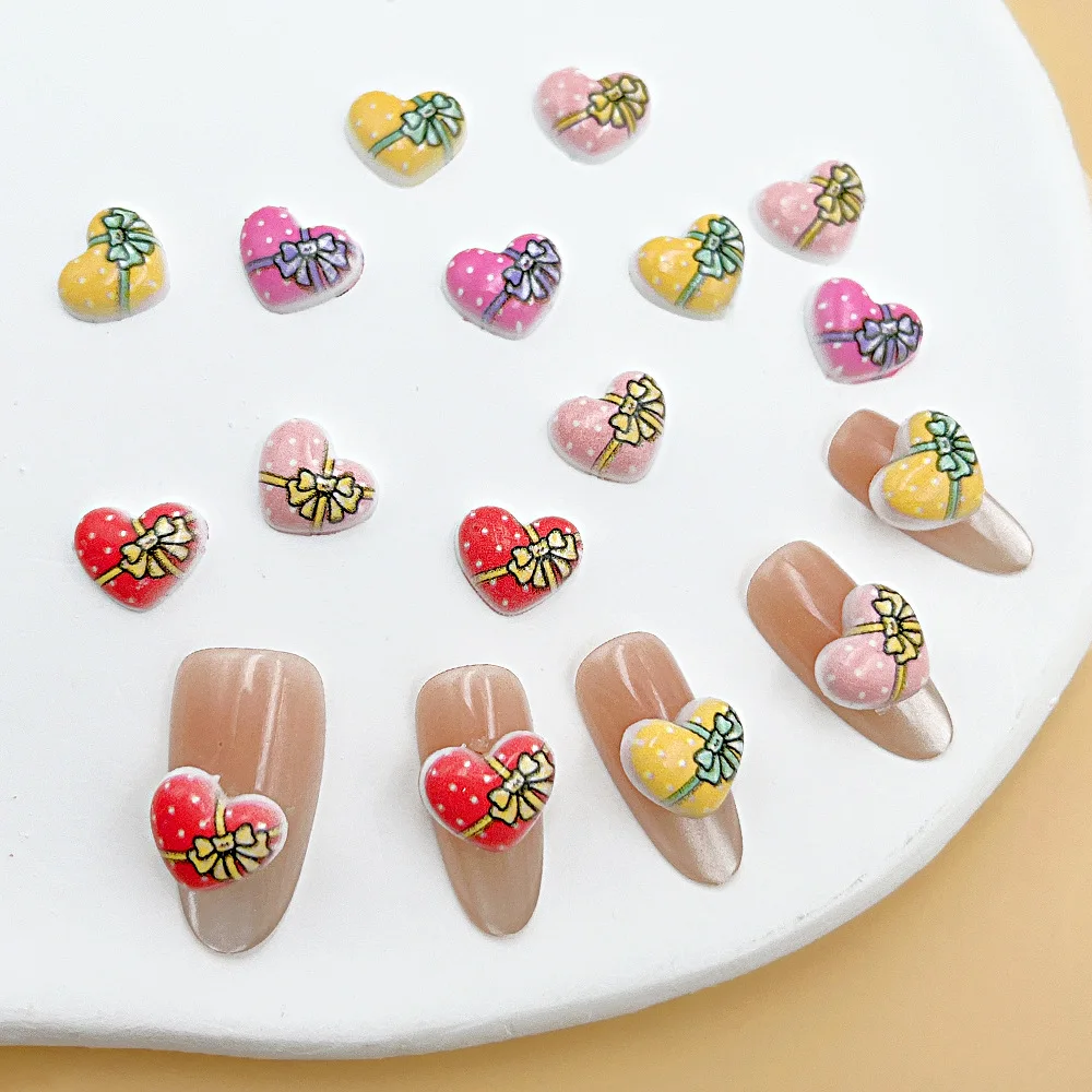100 unids/pack 9 × 11mm caja de regalo de corazón dijes de resina para uñas-arte de uñas con lazo 3D, bonita decoración de uñas a presión para manicura romántica DIY