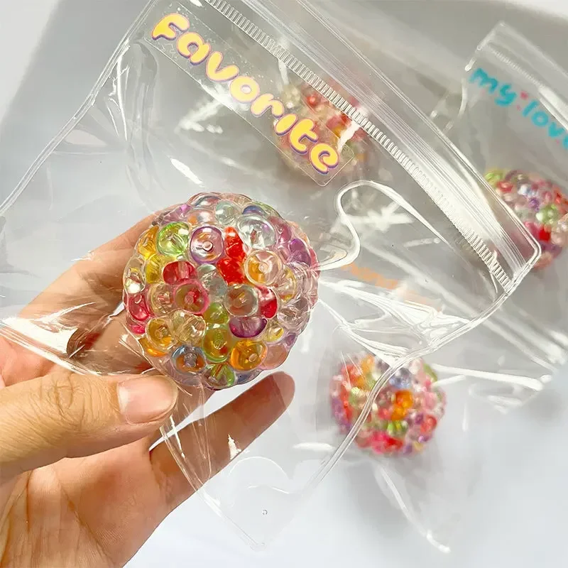 Color Bead Grape Stress Ball, transparent honeycomb TPR shell filled with multicolor glossy beads, individually packed sealed bag, beads bulge and flow when squeezed, elastic durable, dreamy macaron colors, portable healing fidget toy.