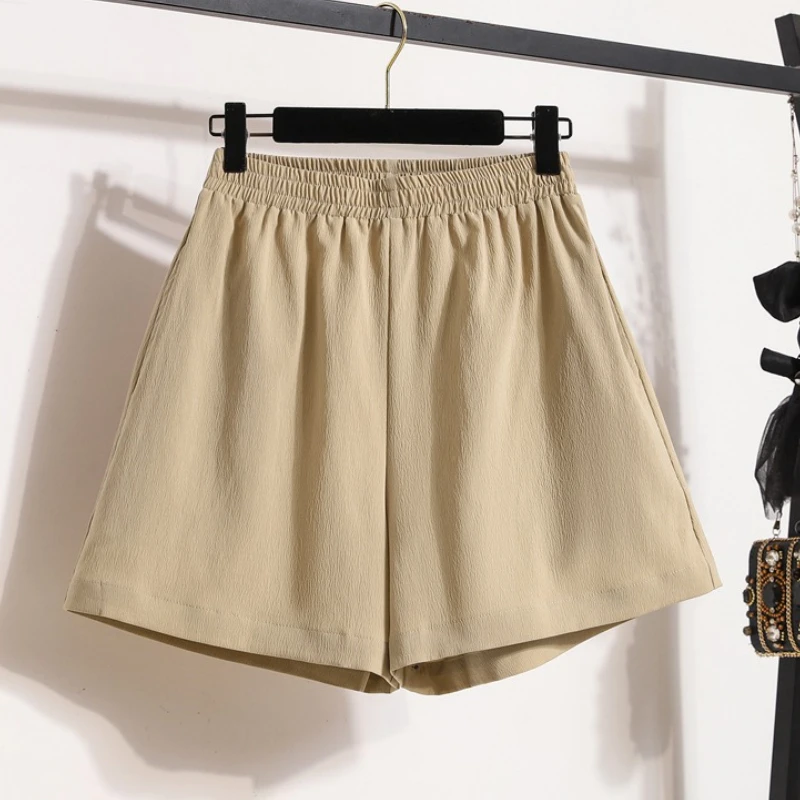 Damskie sportowe szorty z wysokim stanem, luźny krój, szerokie nogawki, jednolity kolor, kieszenie, elastyczna talia, krótkie spodnie, nowy styl 2025.