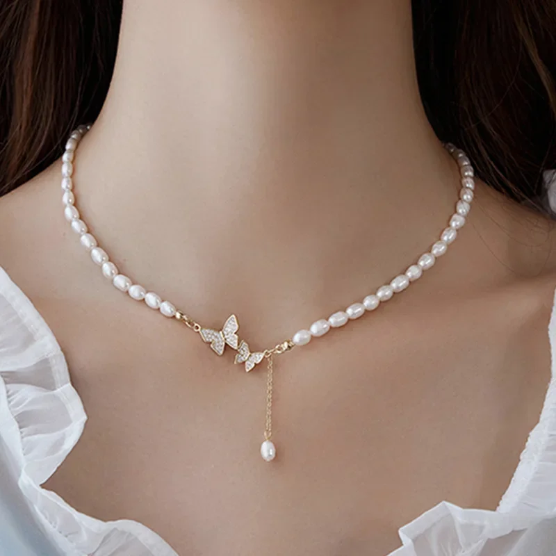 

YWYC 6-7mm Rice Shape Freshwater Pearl Necklaces for Women 40cm+4cm Shine Zircon Butterfly Buckle Pearl Necklaces Jewelry Gift