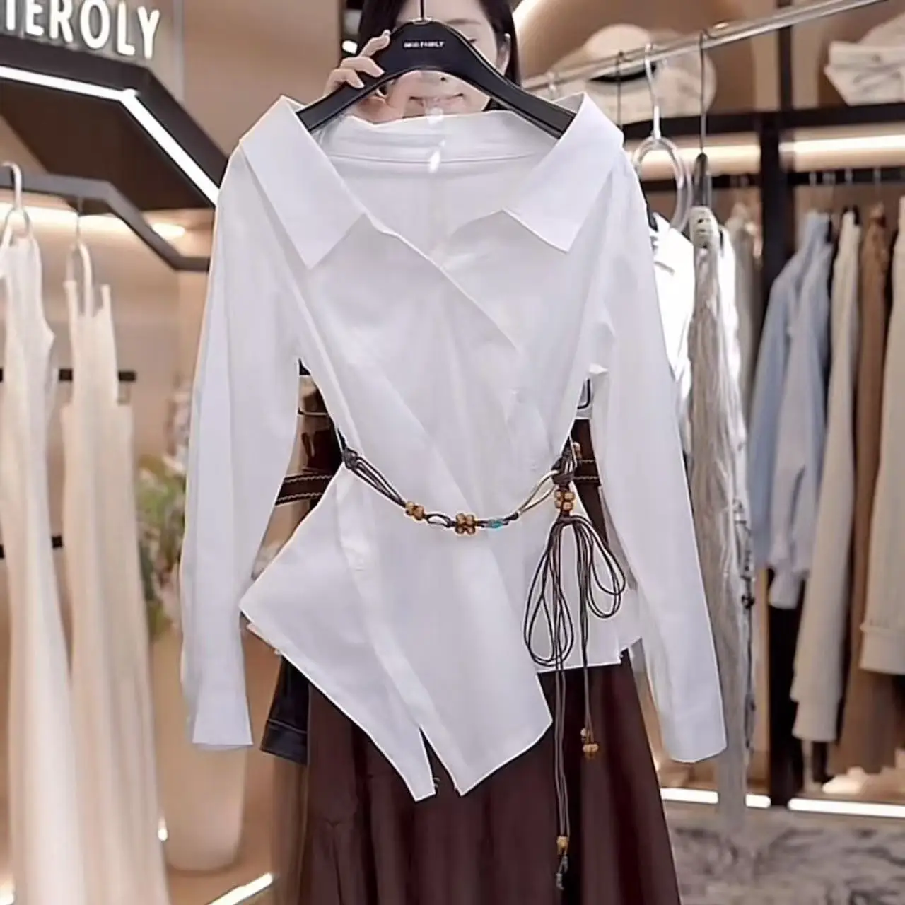 

French fashion irregular waist long-sleeved shirt women's 2025 autumn Korean desire style one-word collar off-the-shoulder top