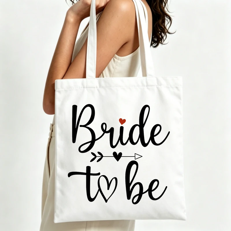 handwritten text canvas tote bag with heart and arrow design, ideal for bachelorette parties and wedding celebrations