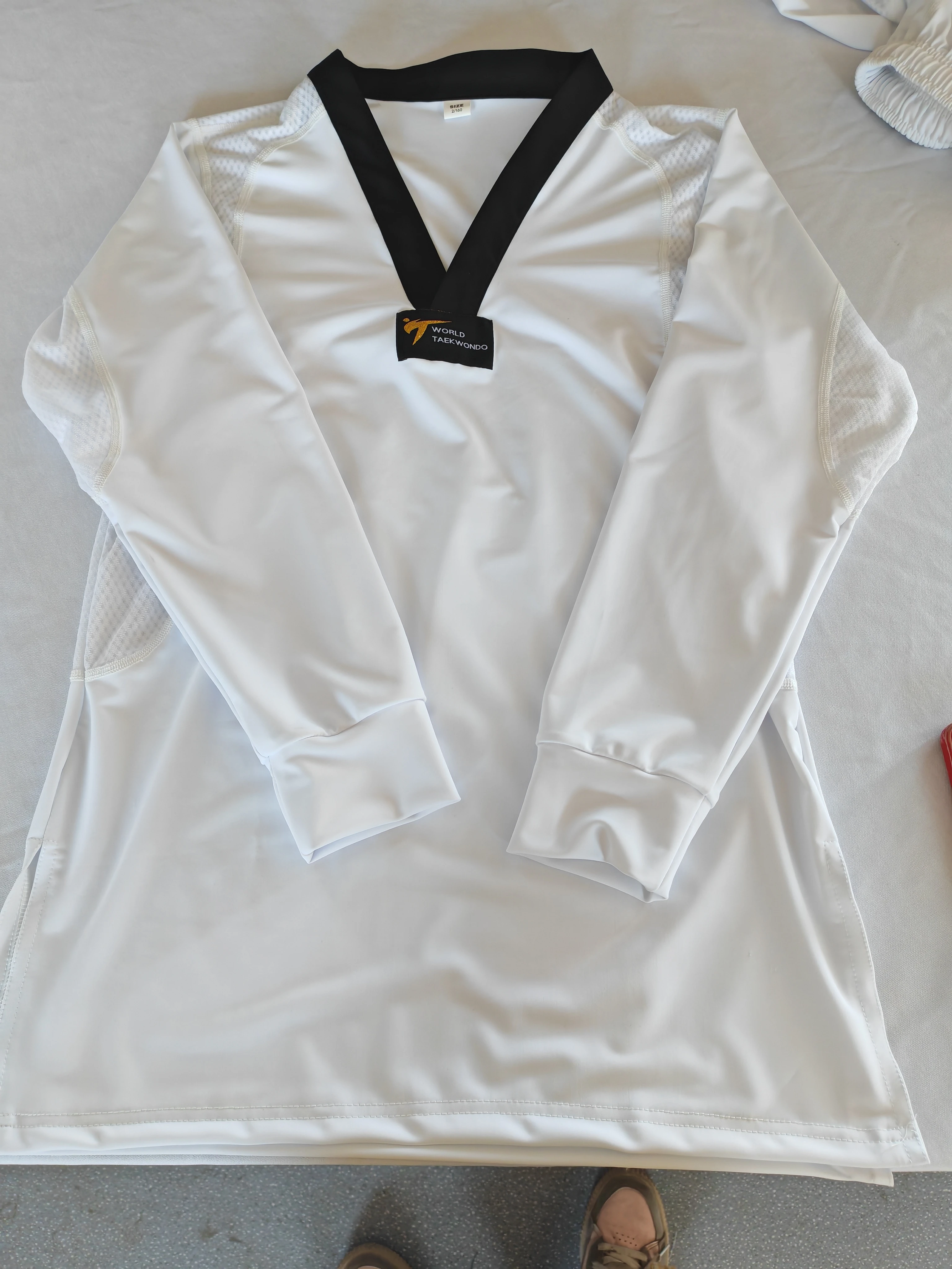 L'ultima nuova uniforme professionale da taekwondo per bambini adulti, leggera, per studenti, elasticizzata, attillata, ad asciugatura rapida, da competizione, da guerra