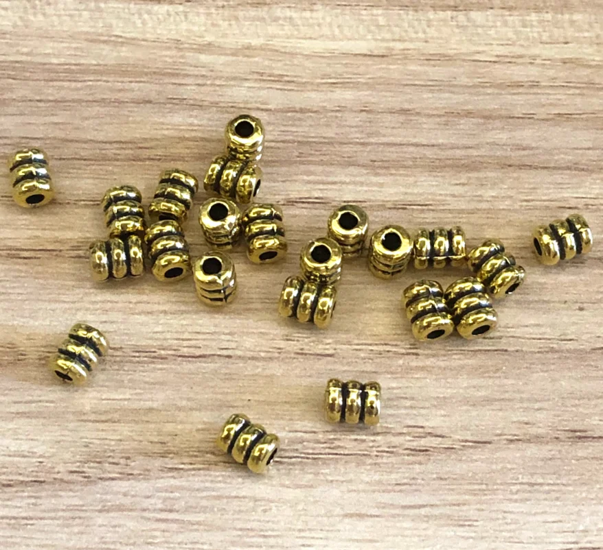 

100pcs 5.5 x4mm , hole1.5mm Alloy metal antiqued gold spacer beads HWH2056