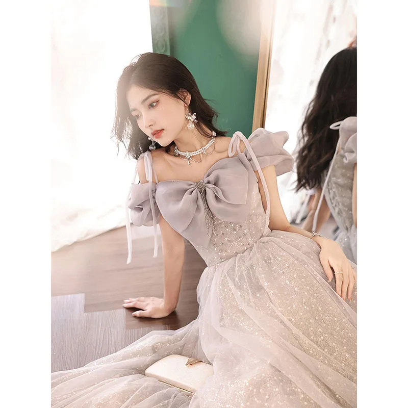 ชุดราตรีผู้หญิงแบบใหม่ ตกแต่งโบว์ สายรัด แต่งแขนพอง ประดับกลิตเตอร์ สไตล์หวาน เหมาะสำหรับงานเลี้ยง งานสอบ หรือการแสดง
