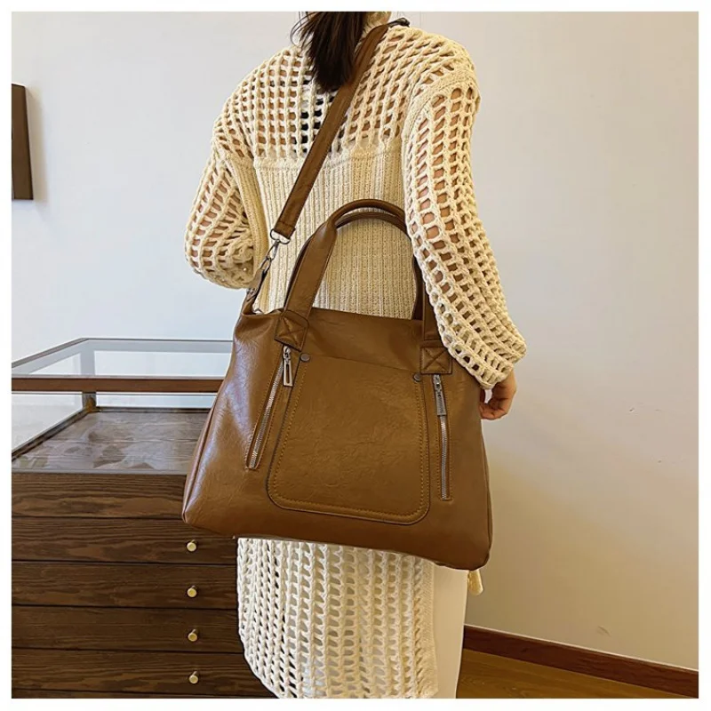 

Classic And Elegant Tote Bag For Ladies, Spacious Leather Construction By Famous Designer With Multiple Interior Pockets