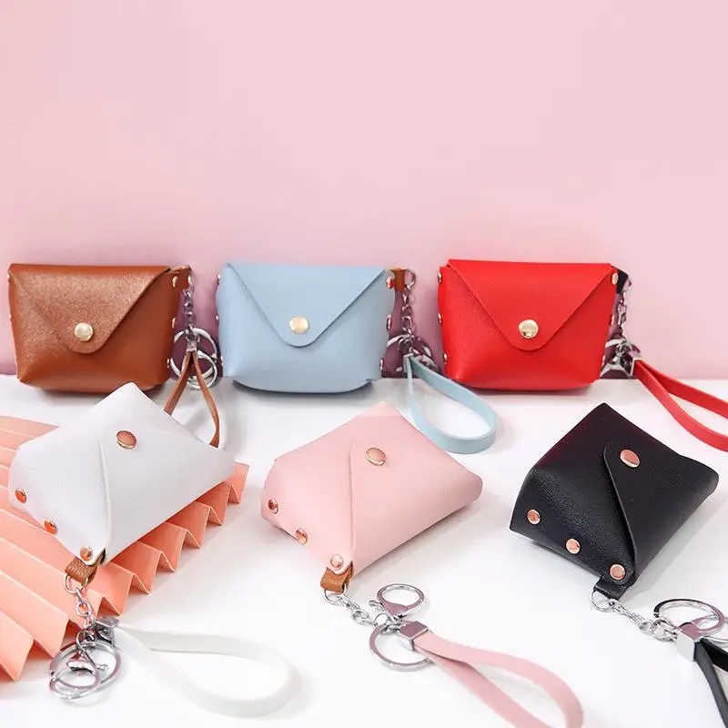 Mini portamonete alla moda Semplice portamonete portatile in pelle PU Borsa portaoggetti per cuffie Portafoglio piccolo con cinturino da polso per donna uomo