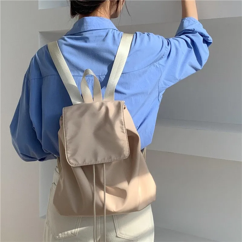 

Корейский рюкзак для женщин, новинка 2024, модный простой Повседневный вместительный нейлоновый рюкзак, черный дорожный студенческий рюкзак для колледжа