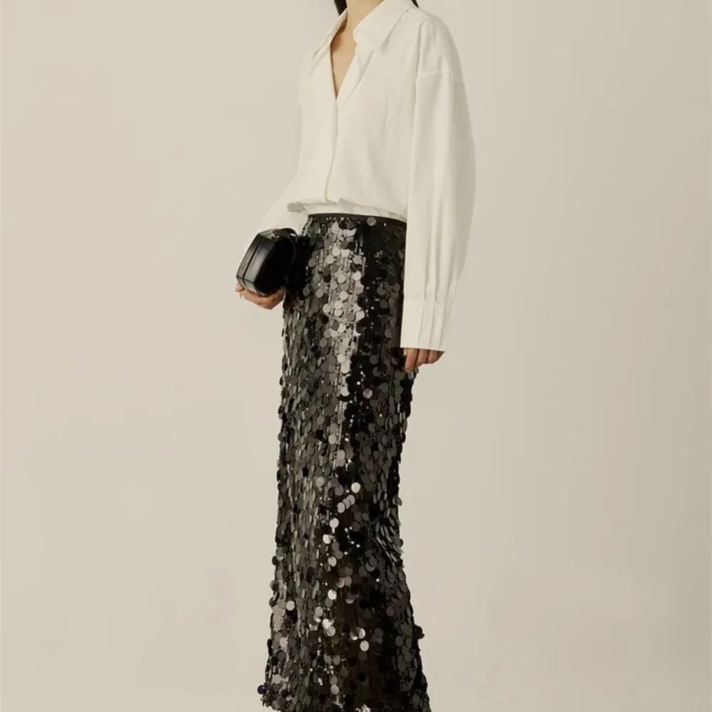 Autumn new elegant style sequin black straight through long skirt for women