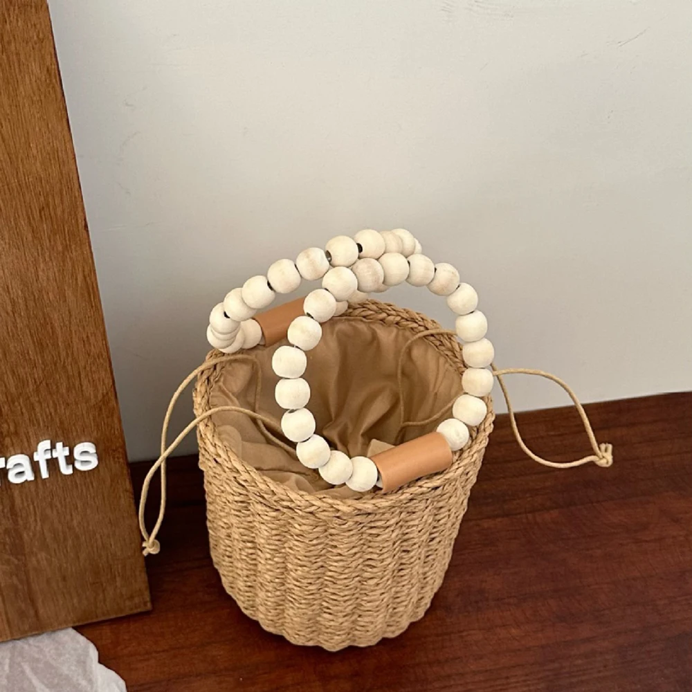 Neue Damen Stroh-Seil-Gewebte Bucket Bag mit Holzperlen-Griff, Kordelzug, gefütterte zylindrische Handtasche mit Umhängegurt, Strand-Strohtasche