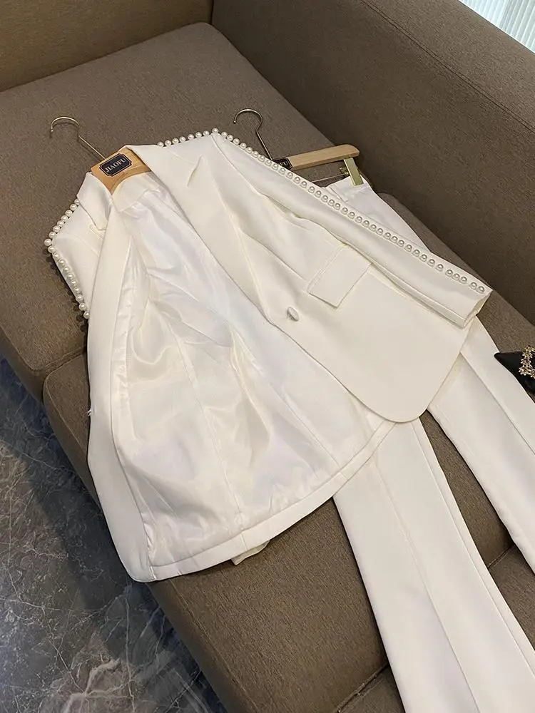 بدلة ميدي بيضاء علوية وبنطال ذو قصة أرجل واسعة طقم مكون من قطعتين ملابس نسائية قابلة للتجاعيد للأعمار من 25 إلى 35 عامًا صنع في الصين