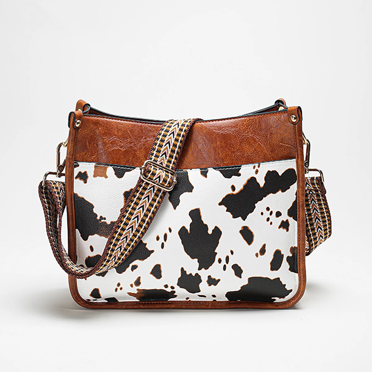 

Women's Western-style milk-patterned color-blocked PU crossbody bag, small and cute, versatile everyday bucket bag.