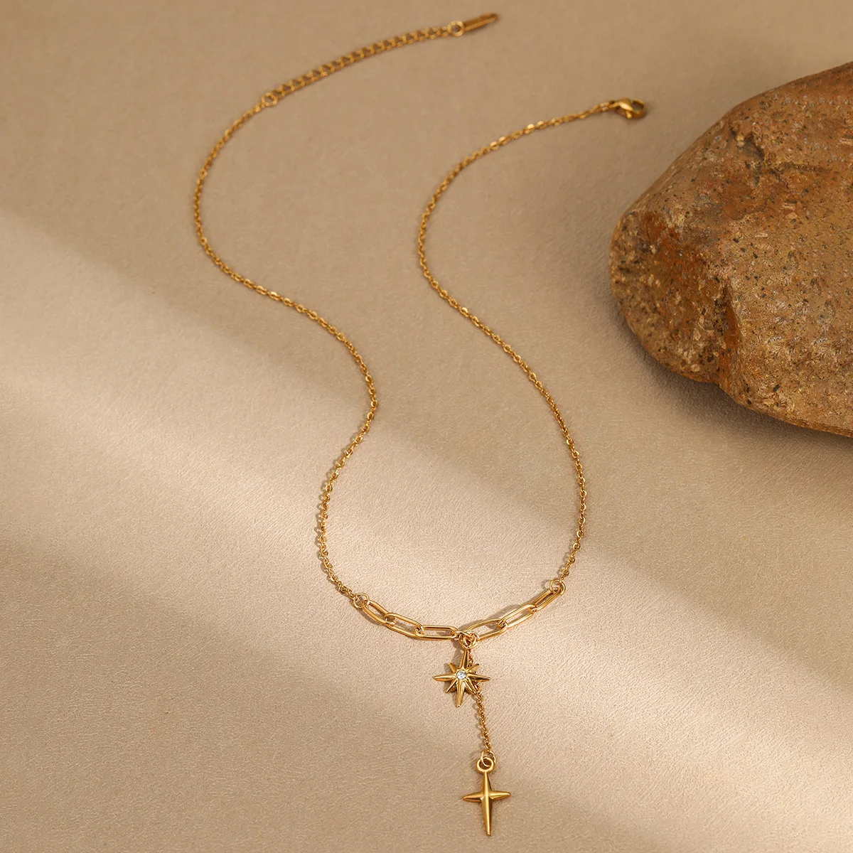 Octagonal star necklace with dangling cross pendant and star-shaped stainless steel necklace