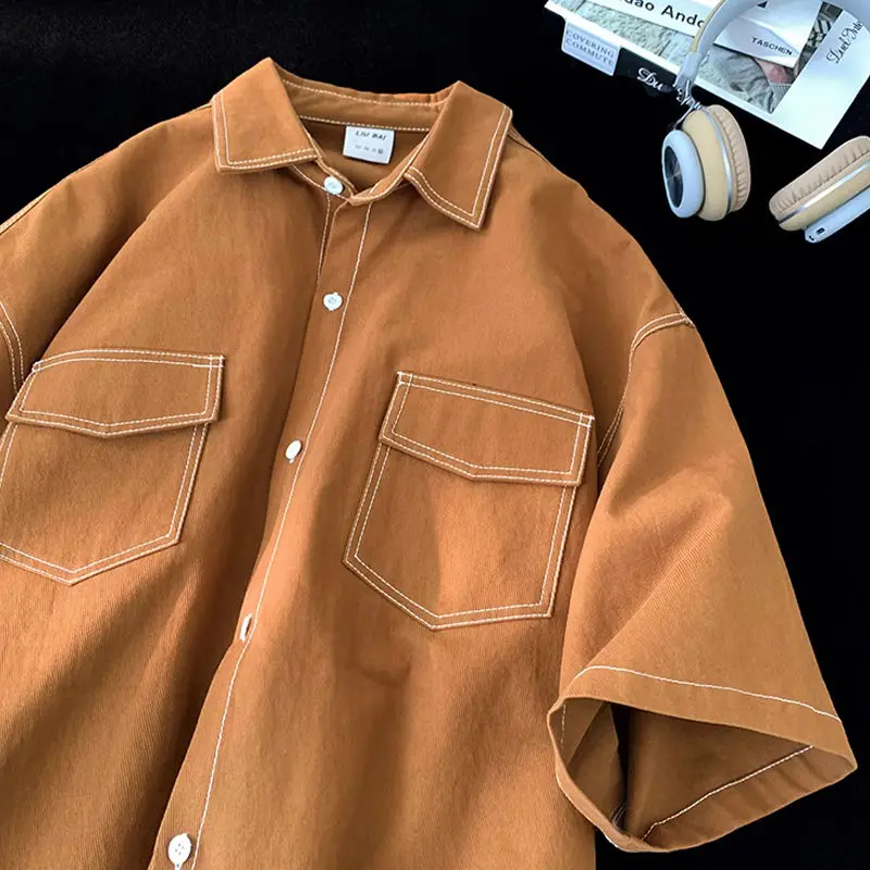 Camisa de manga corta de estilo neutro japonés para hombre, camisa de solapa suelta de nicho de diseño superior, ropa de trabajo informal, chaqueta