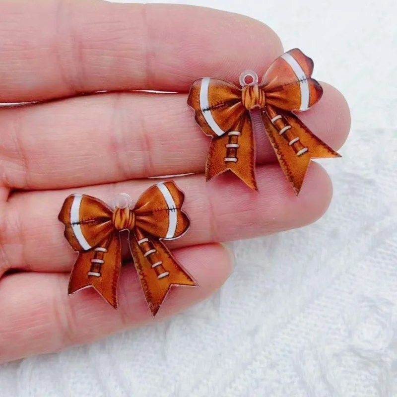 10 pieces of acrylic football rugby element bow pendant earrings necklace keychain DIY production process