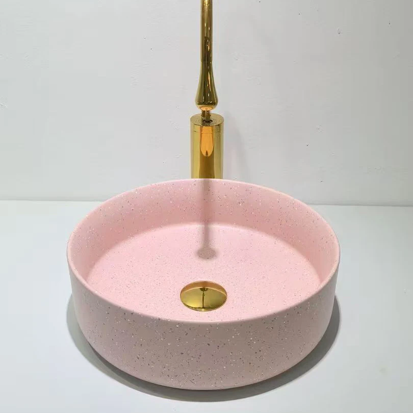 

Modern design ceramic pink round wash basin above counter with apartment drain