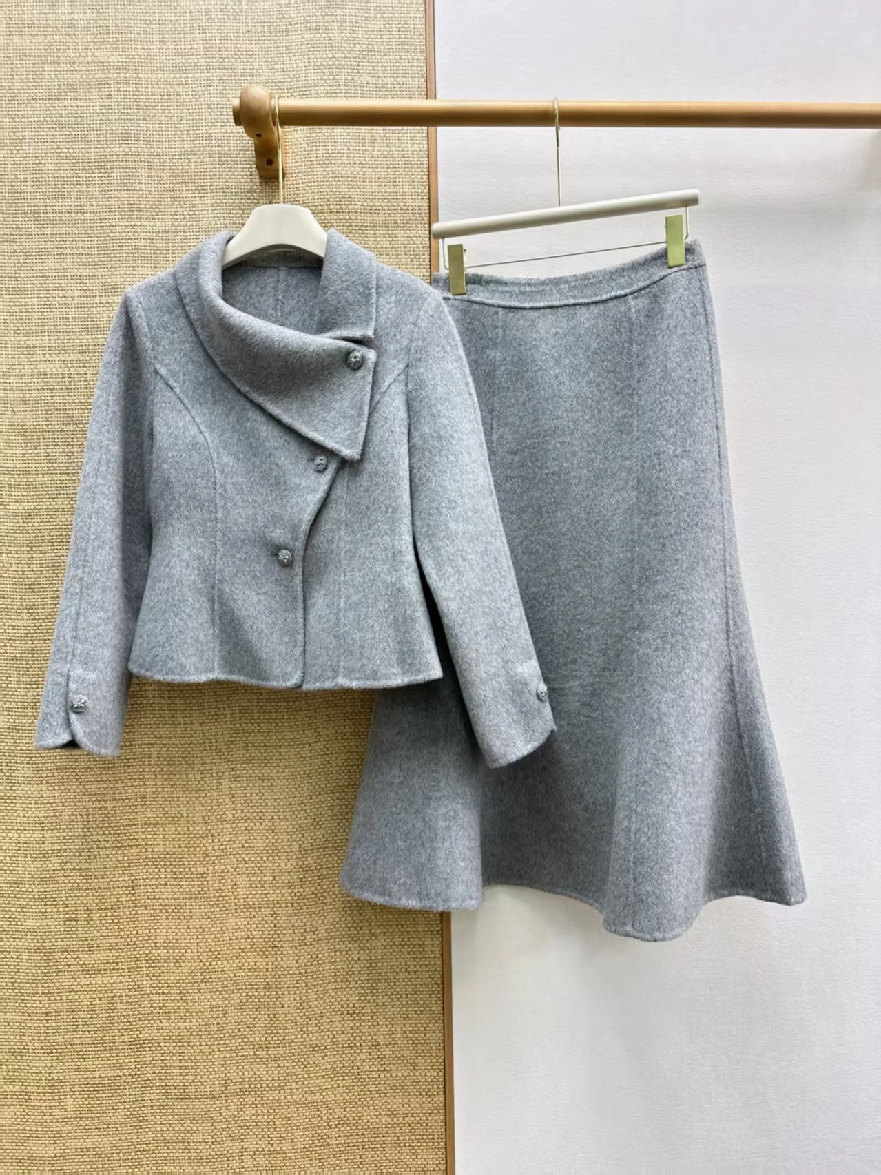 Autumn and winter new double-sided woolen irregular slanted collar pearl button short jacket fish tail skirt set