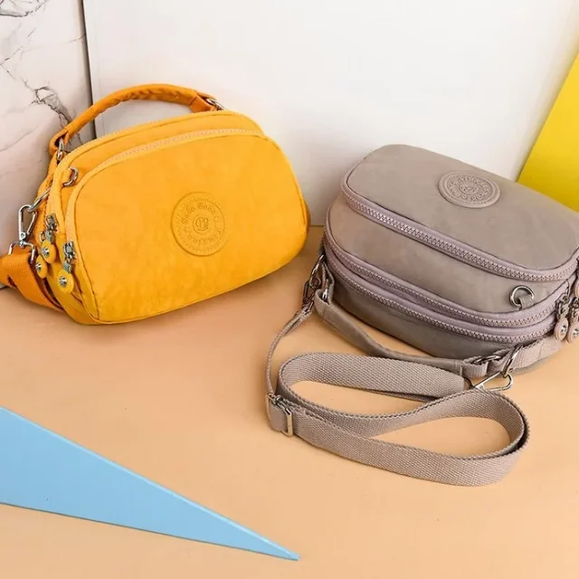 Nowa damska jednokolorowa płócienna torba na ramię francuska designerska torba Crossbody na telefon komórkowy organizator przyborów toaletowych torba kurierska