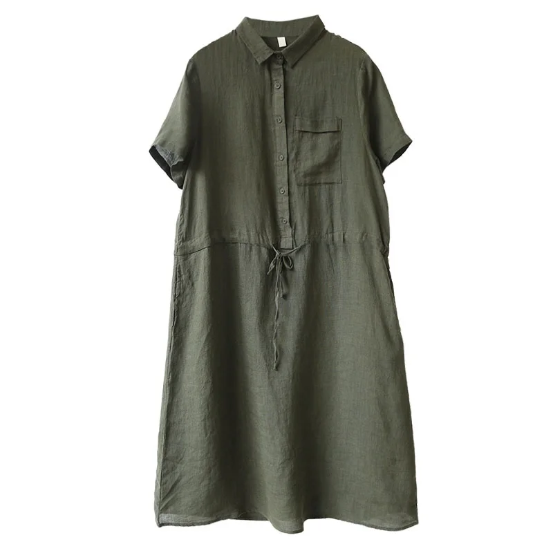 Artystyczna, swobodna, wyszczuplająca lniana spódnica damska o średniej długości, w kształcie litery A, zapinana na jeden guzik, z kołnierzykiem.