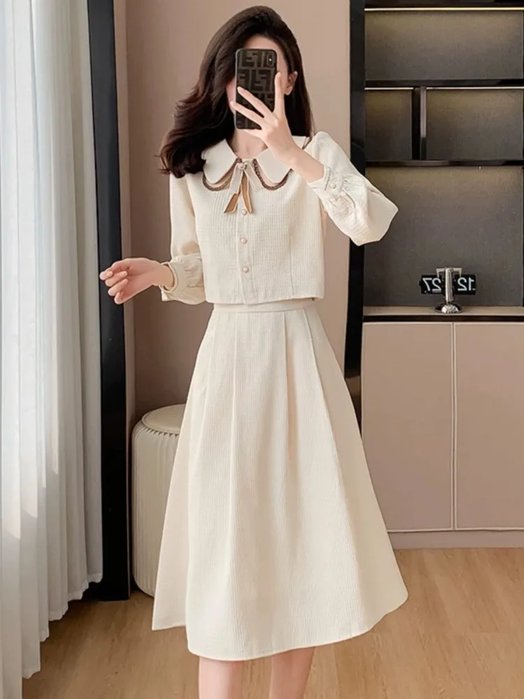 

UNXX Small Fragrant Style Fashion Set Women's Spring Dress Doll Neck Long Sleeved Top + Temperament Half Skirt Two Piece Sets