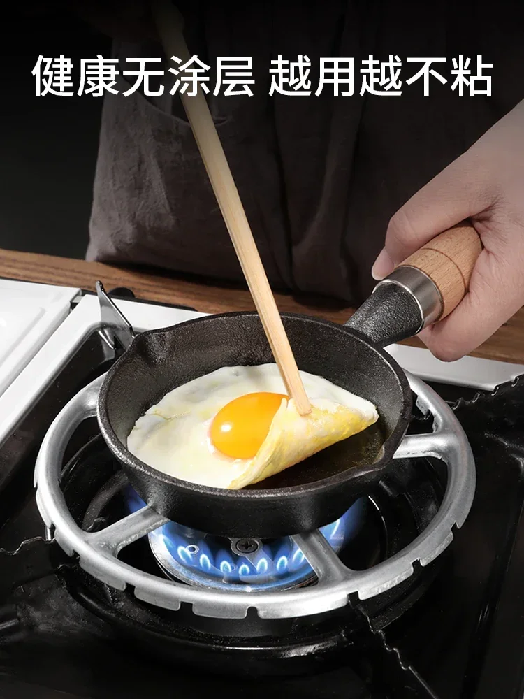 Cast iron frying pan with oil and hot oil, small pan for  eggs, special small  pan for frying eggs