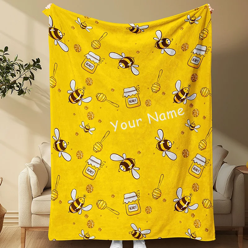 A gold country style bee and honeycomb patterned blanket with reversible knitted flannel polyester office nap and multifunctiona