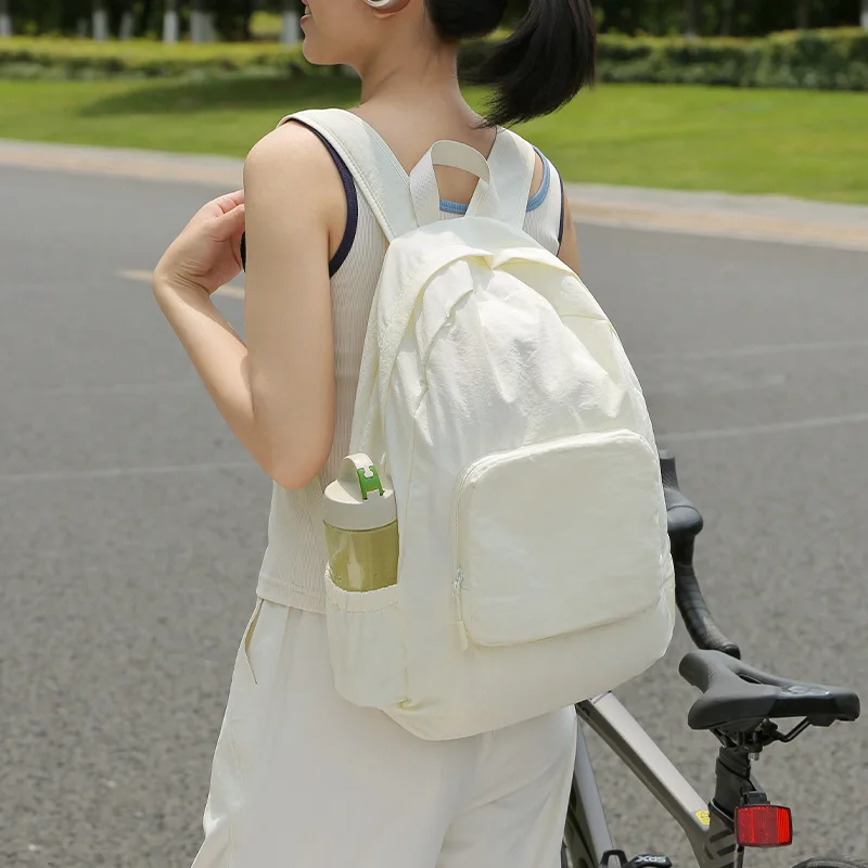 Women's Cream Foldable Backpack with Front Zipper Pocket Side Water Bottle Holder Casual Lightweight Daypack for School Travel