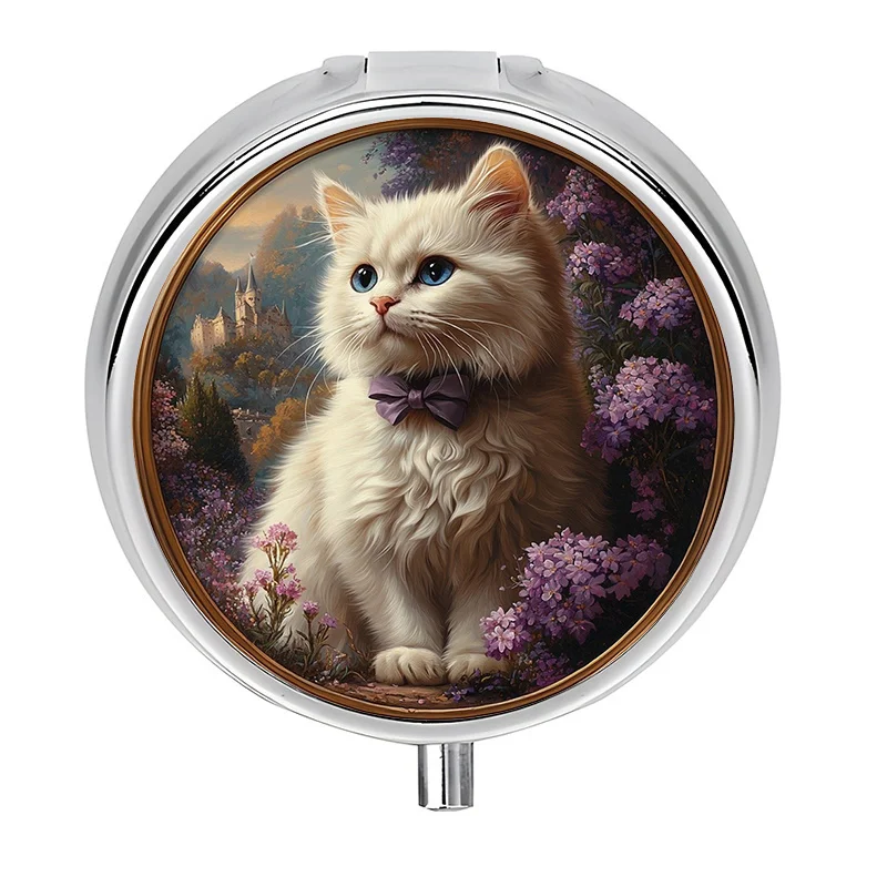 A small pill box with a three-compartment design, featuring a cat portrait and a fairy garden theme, including floral and castle scenery. This compact pill box is the perfect gift for travel and everyday use