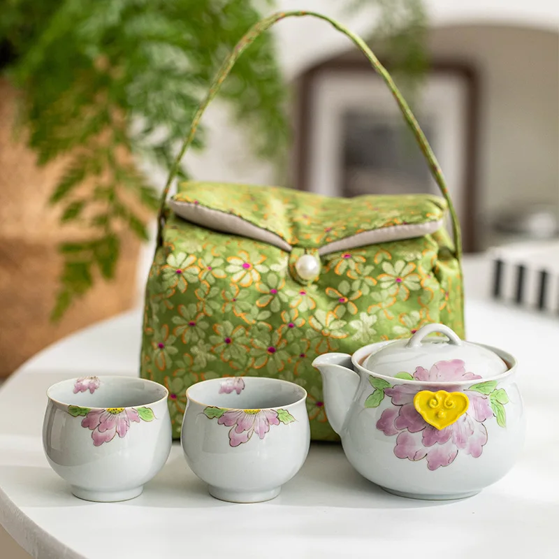 

Ручная роспись Фиолетовый Пион Кунг-Фу Чайный сервиз Трава Ясень Подглазурный цвет Один горшок Два чашки Сумка для хранения Бытовой керамический дорожный набор