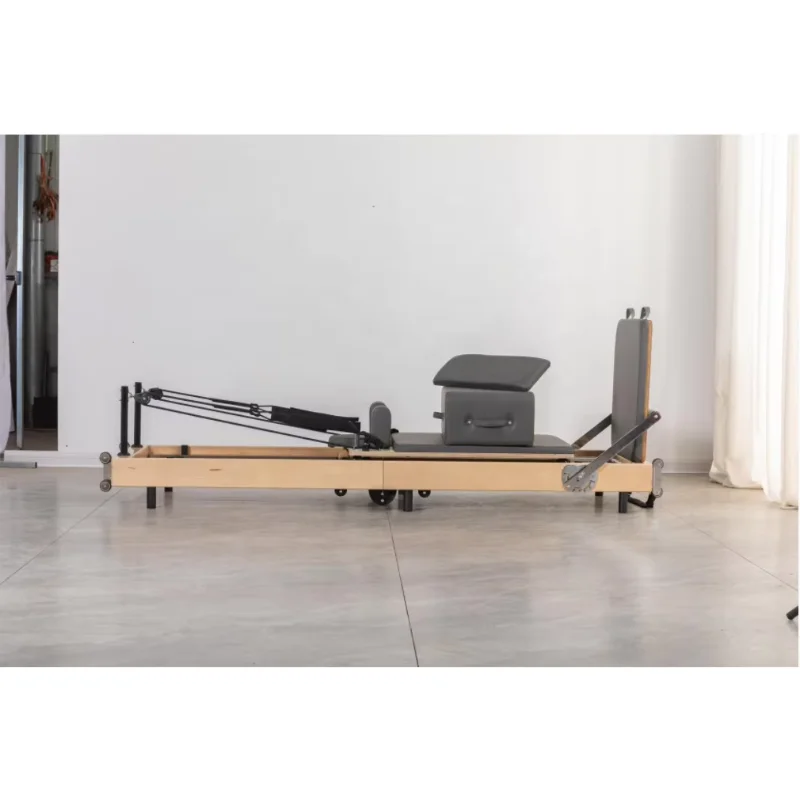 Equipo de Pilates Deren Zhenqu a la venta, cama central de Pilates plegable de madera de arce, estudio o reformador de Pilates plegable para uso doméstico