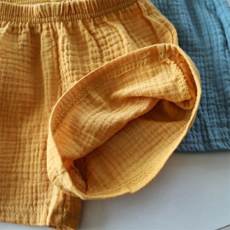 Shorts de algodão e linho para meninas e meninos, cor sólida, calças de cinco pontos para crianças, roupas de bebê, verão