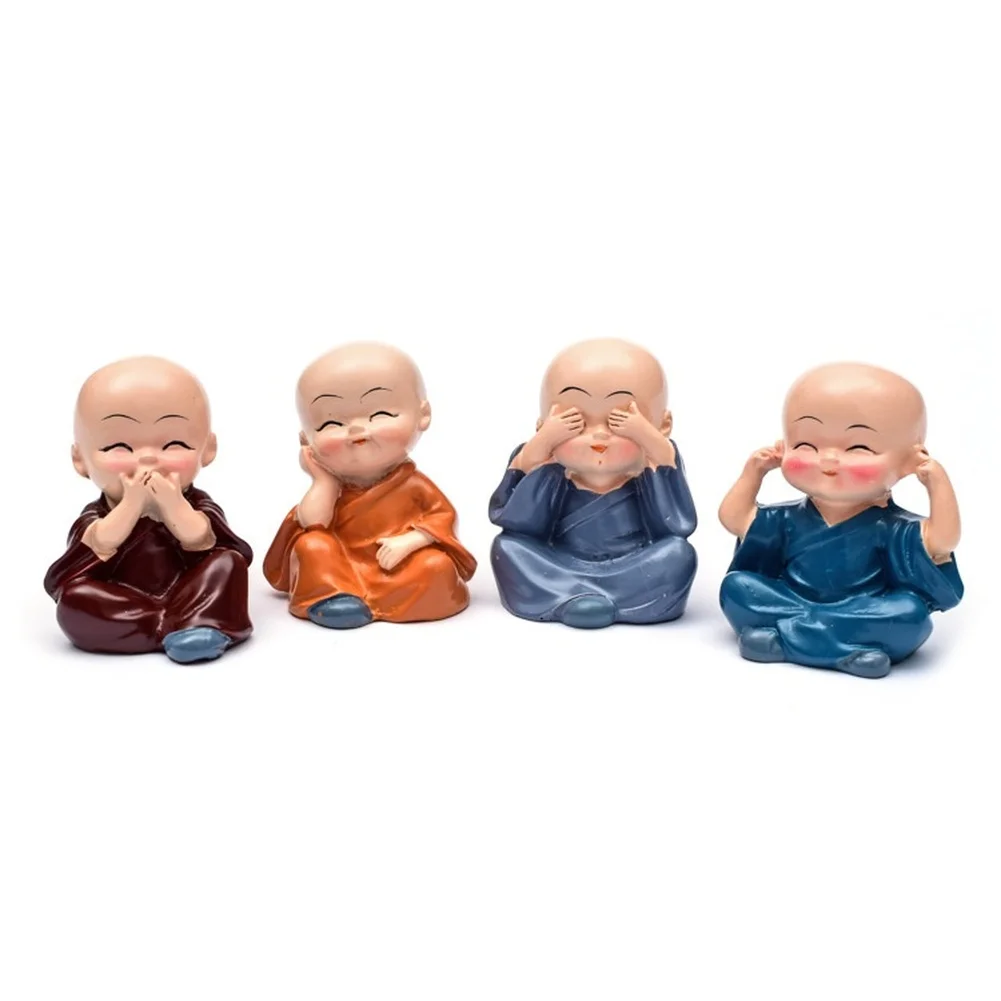 Four multicolored baby Buddha monk statues made of lucky wood resin ideal for car dashboard and small decorative spaces