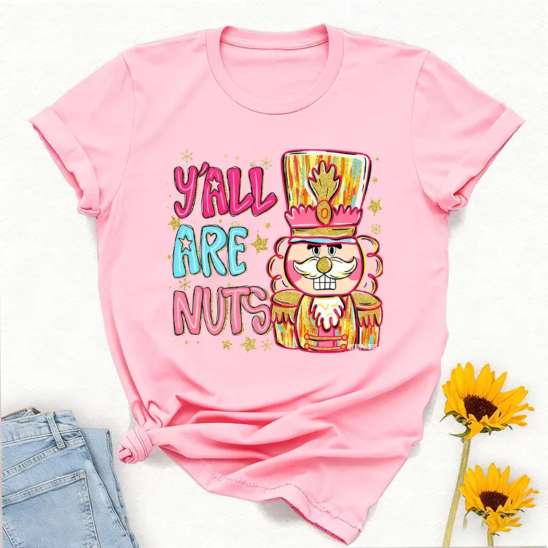 Y'all Are Nuts Coquette كسارة البندق Preppy عيد الميلاد Png السكر البرقوق الجنية المكسرات حول Brushstroke Crewneck تي شيرت مطبوع بلايز