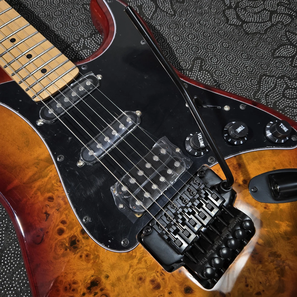 High-quality electric guitar, burl veneer, maple neck,  S-S-H pickups, double-locking tremolo system, in stock fast shipping