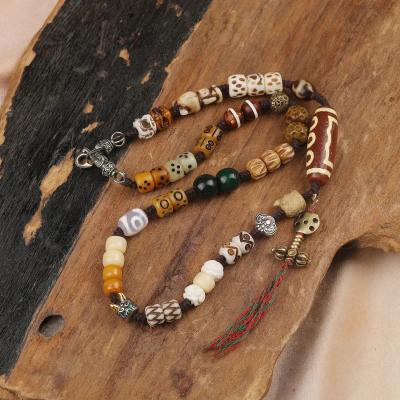 

Tibetan-style five-eye agate dzi necklace pendant with cow bone bead accessories and handmade braided cord