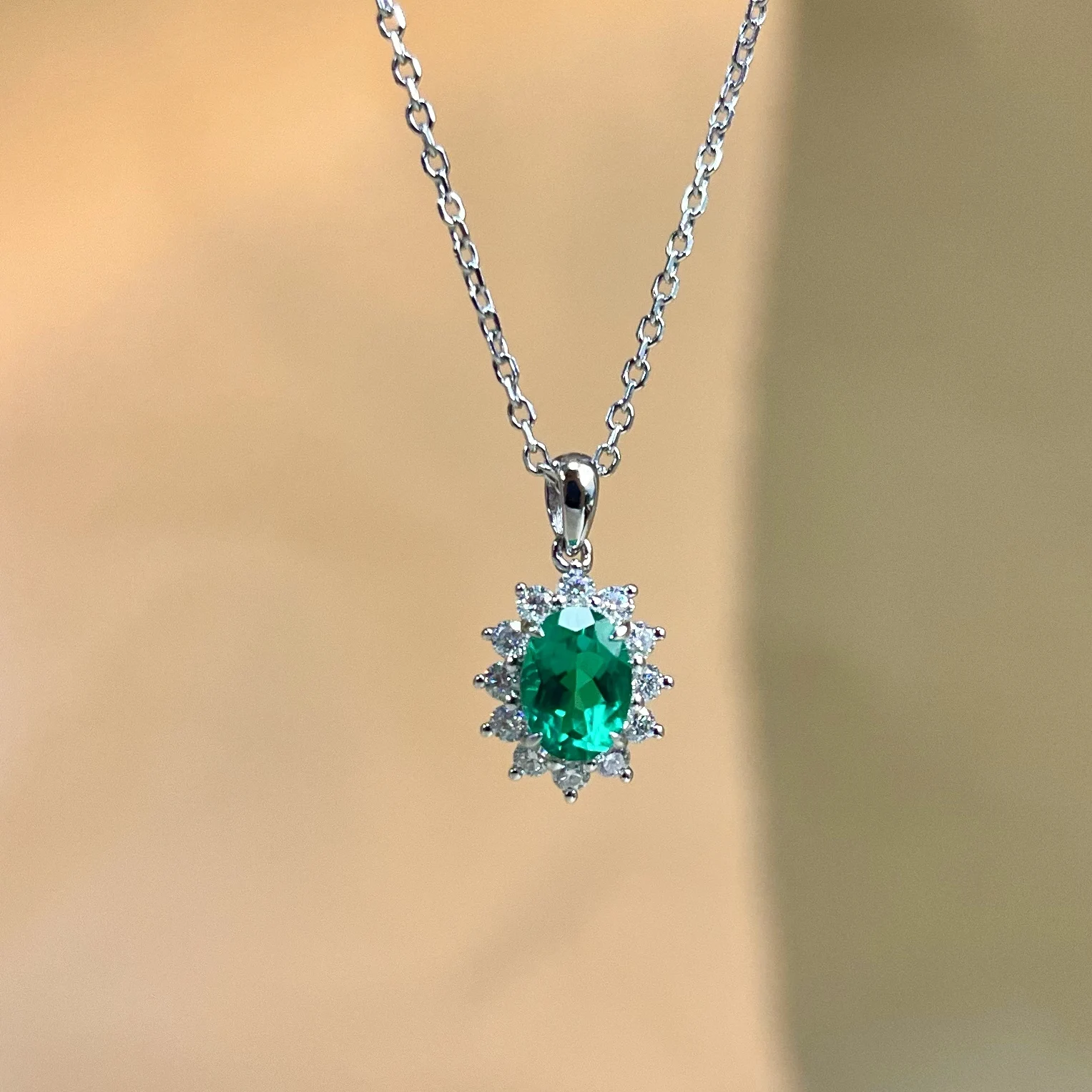 S925 sterling silver, cultured wood, green emerald necklace with classic everyday surround-set diamond pendant design.
