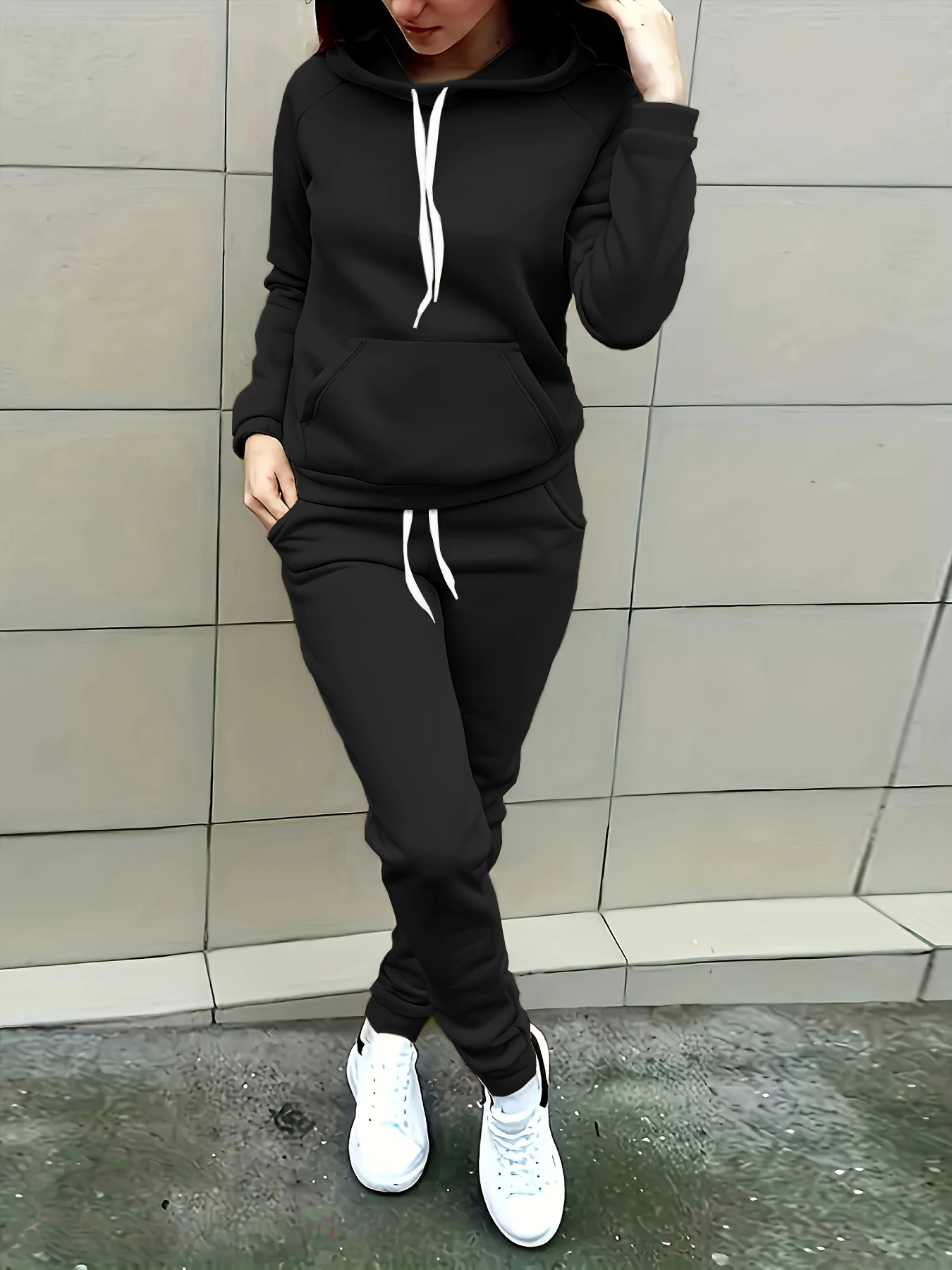 European and American style women's sports two-piece set: long-sleeved top with round neck and side stripe decoration, paired with jogger pants. Loose, drop-shoulder design. Suitable for home, travel, and casual wear