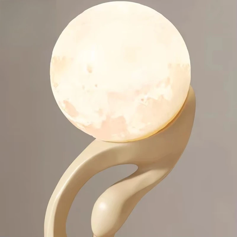 Designer of the floor-standing sculpture lamp featuring modern minimalist art decoration with standing and glowing diodes.