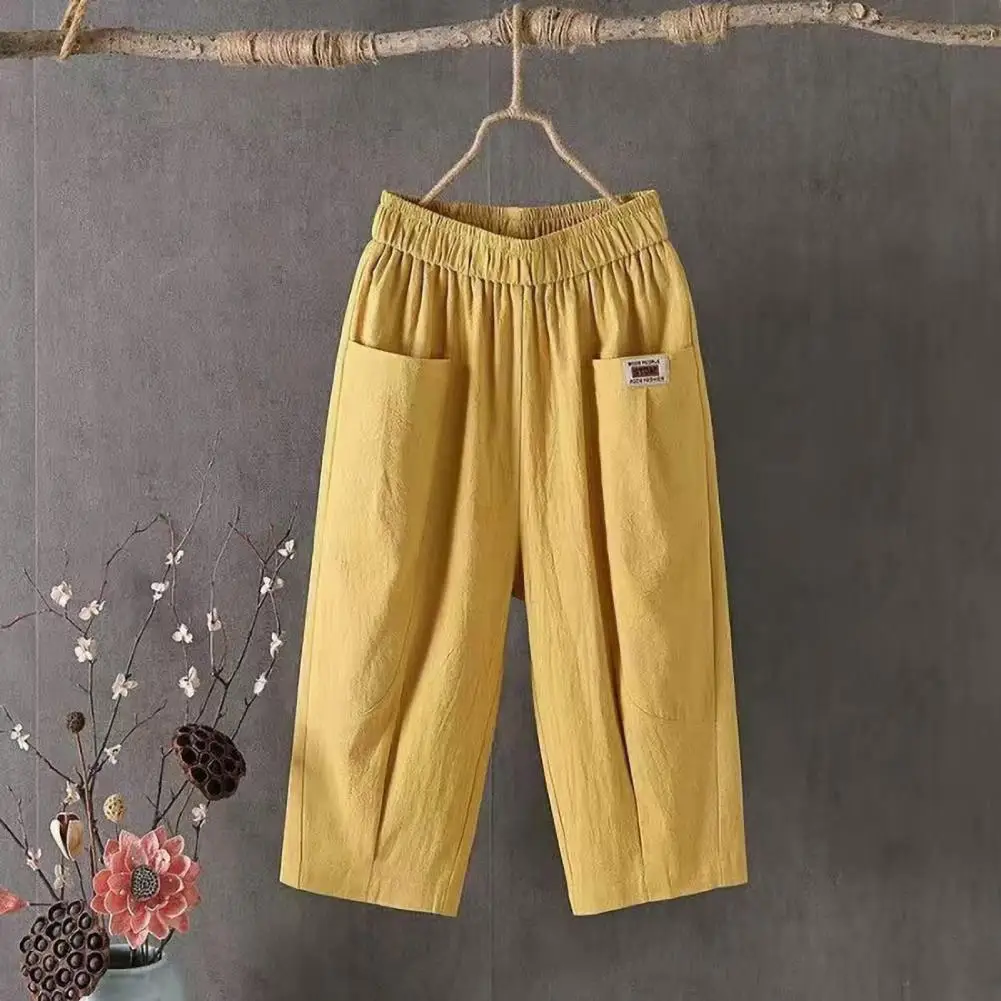 Calça recortada de verão feminina, cintura elástica, perna larga, calça casual, cor sólida, design de bolsos, calça harém