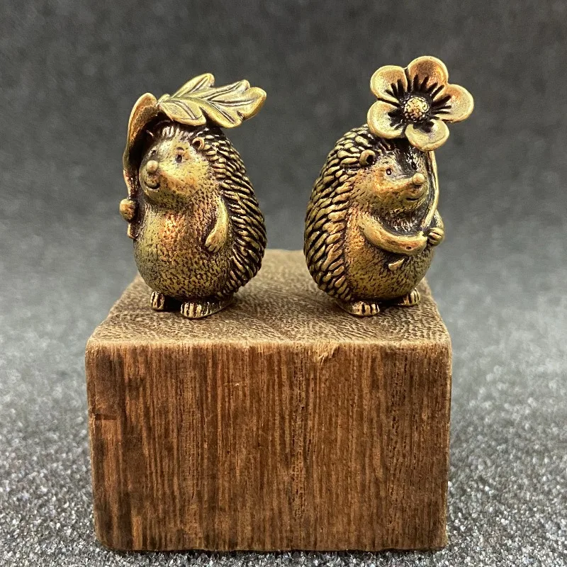 2-pack collectible figure, brass hedgehog statue with leaves and flowers