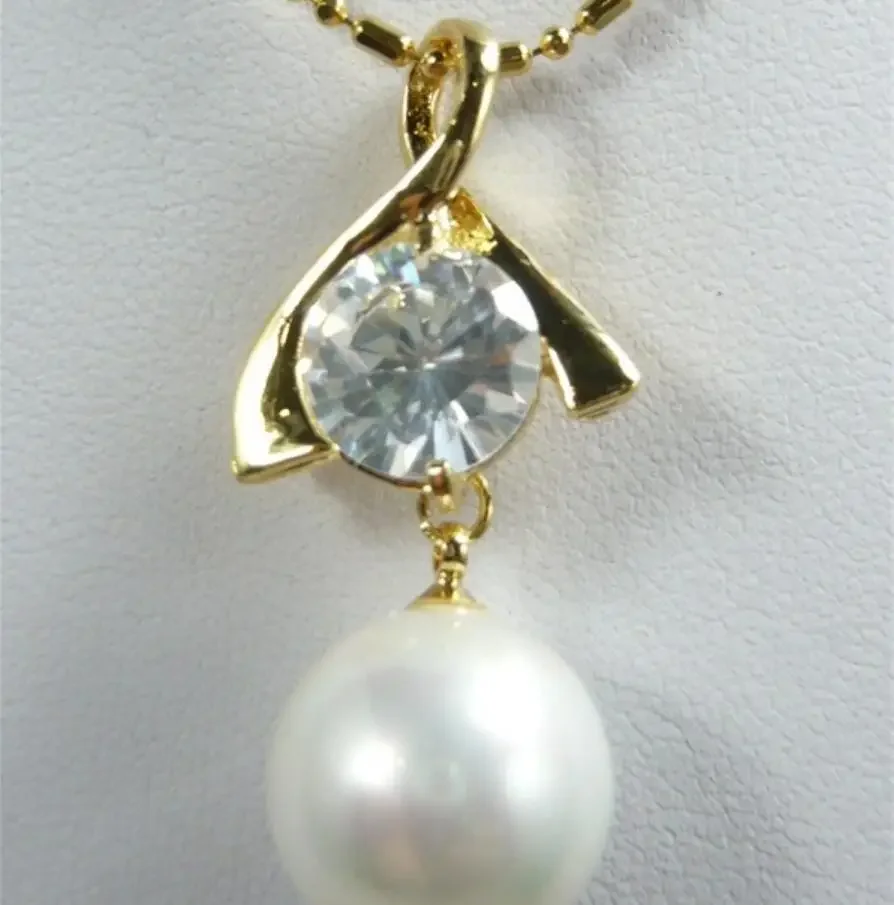 

Women's fashion style gold plated zircon + Round White Shell Pearl Pendant Necklace