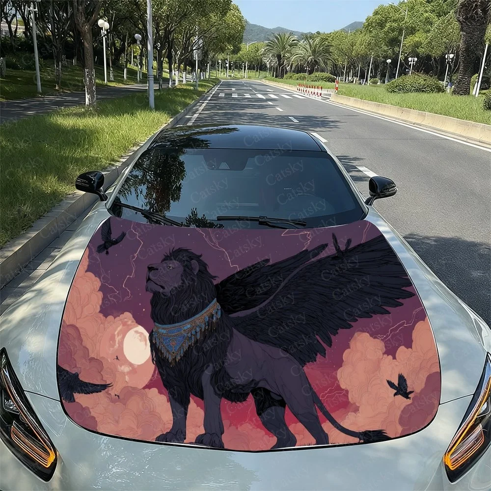 A stunning car hood wrap featuring a winged lion against a vibrant sunset sky, adorned with intricate details and flying birds.