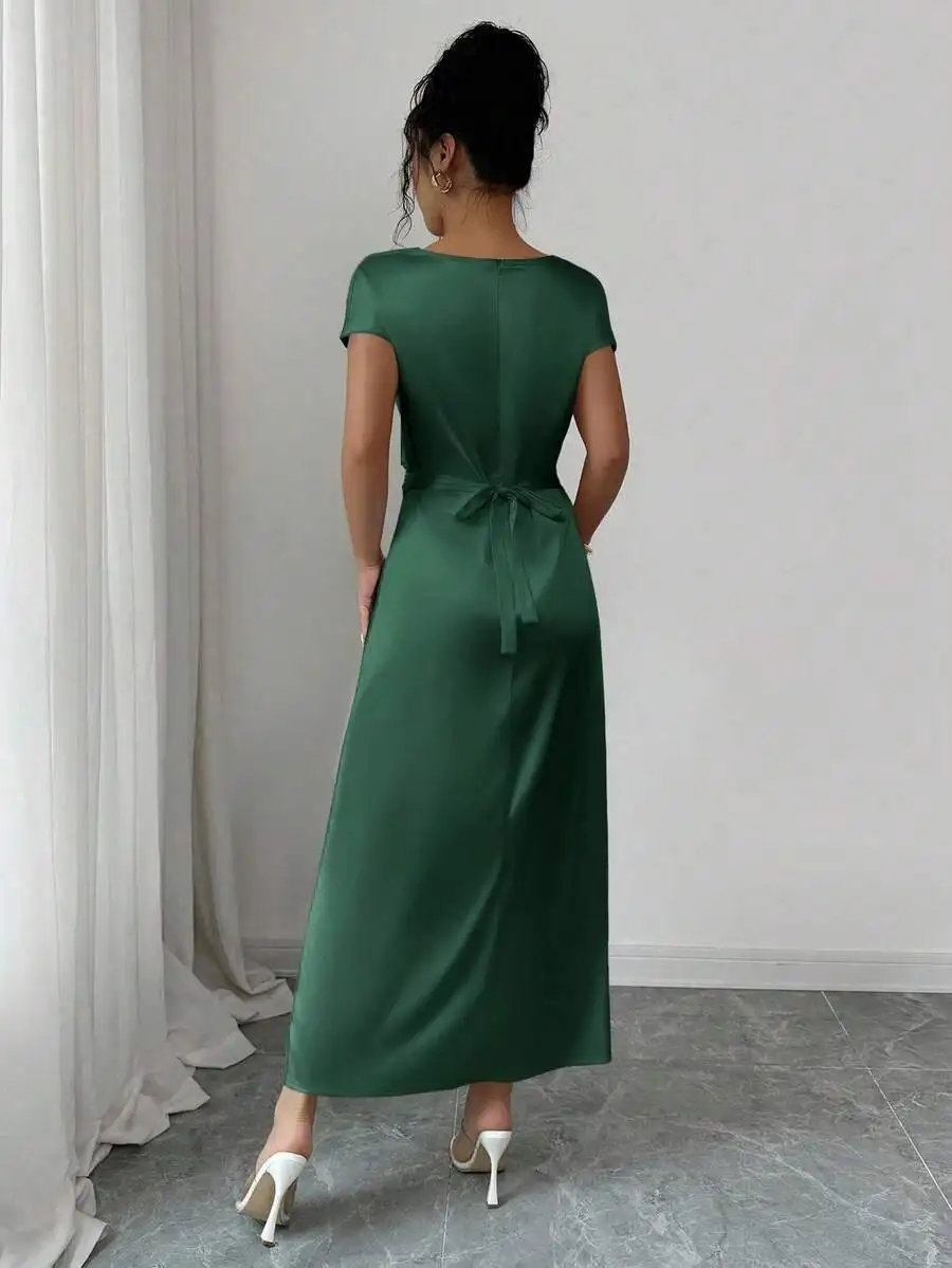 

Forest Green Satin Maxi Dress With V-Back Tie Detail, Short Sleeves, And Smooth Drape For Sophisticated Day-To-Night Elegance