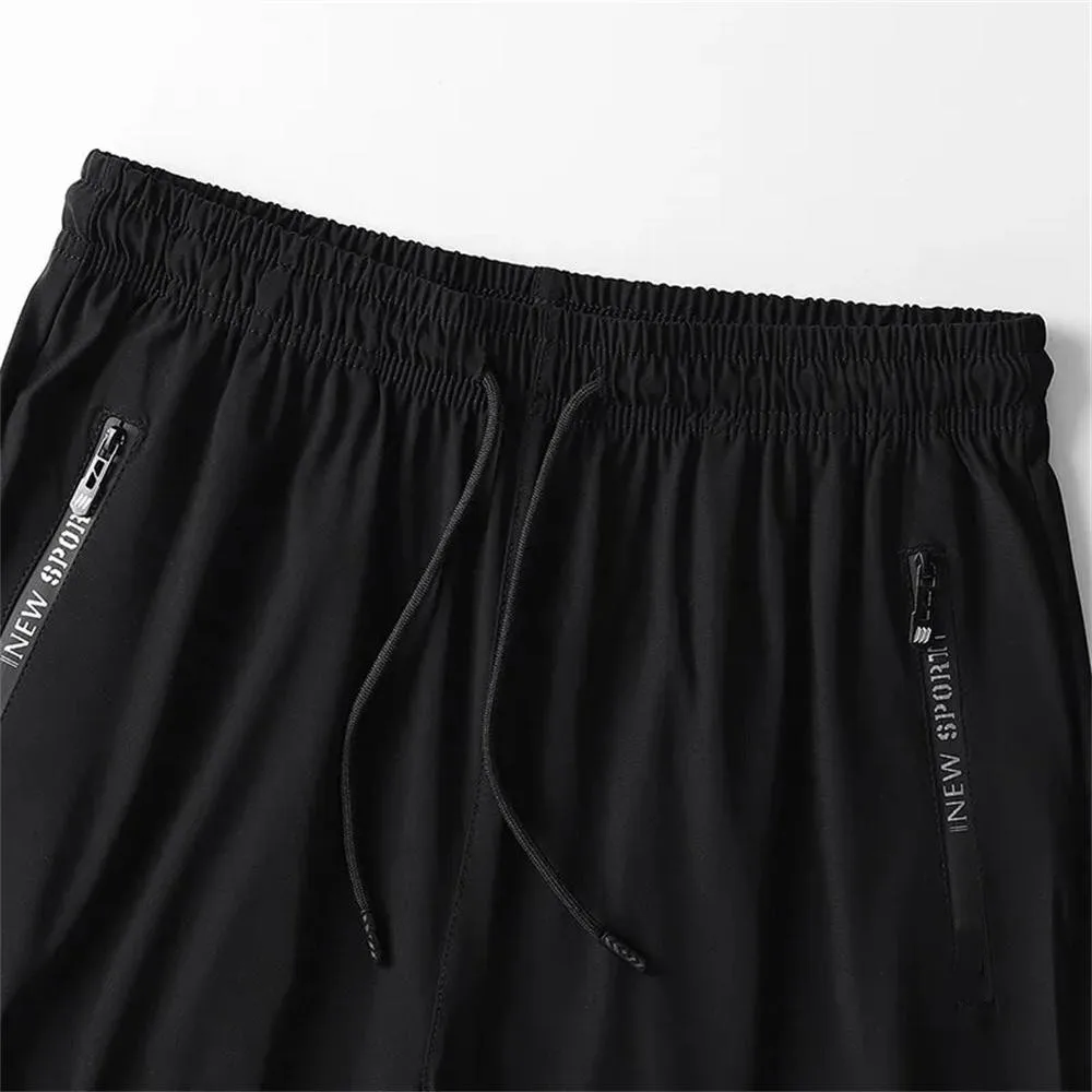 NUOVI pantaloni sportivi taglie forti da uomo moda estate cool pantaloni elasticizzati casual uomo nero grigio pantaloni sportivi lunghi larghi ad asciugatura rapida